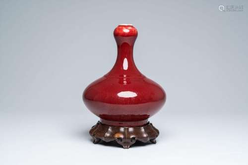 A Chinese monochrome sang-de-boeuf garlic-head mouth vase on...