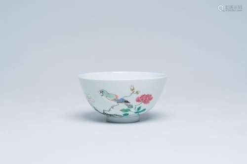 A Chinese famille rose bowl with a bird on a blossoming bran...
