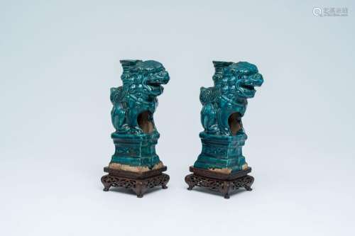 A pair of Chinese turquoise-glazed joss stick holders in the...