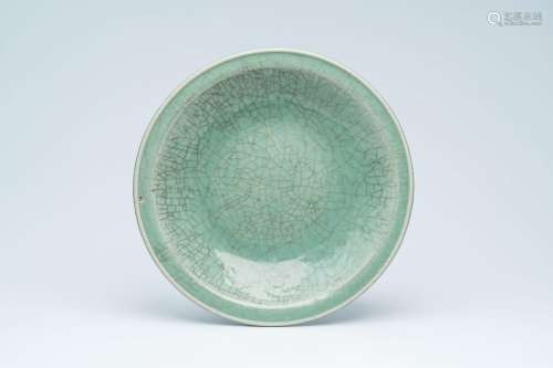 A large Chinese crackle-glazed celadon dish with underglaze ...