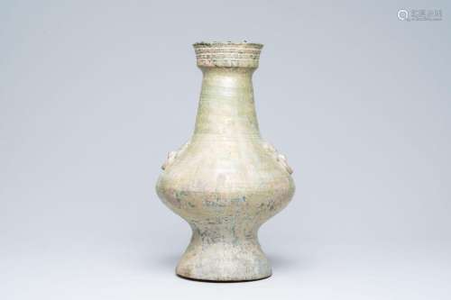 A Chinese monochrome green-glazed 'hu' vase with taotie mask...