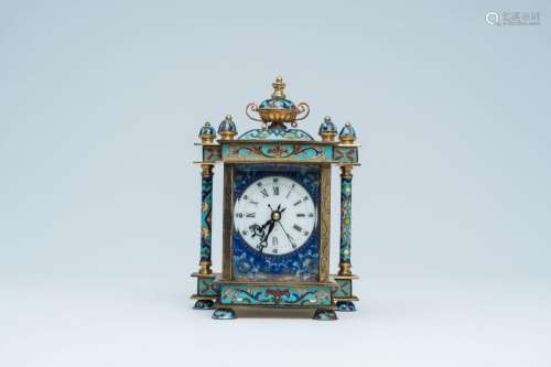 A Chinese cloisonne table clock with enamel plaques for the ...