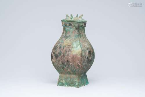 A Chinese bronze 'Fang' vases and cover, Han<br />
H 45,2 cm...