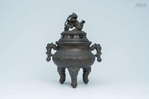 A Chinese bronze incense burner with a Buddhist lion, swasti...