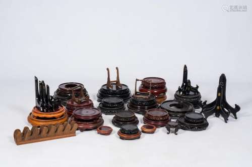 A varied collection of Chinese wood stands and plate holders...