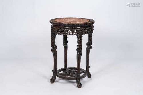 A Chinese reticulated carved wood stand with marble top, 19t...