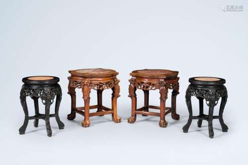 Two pairs of Chinese open worked carved wood stands with mar...