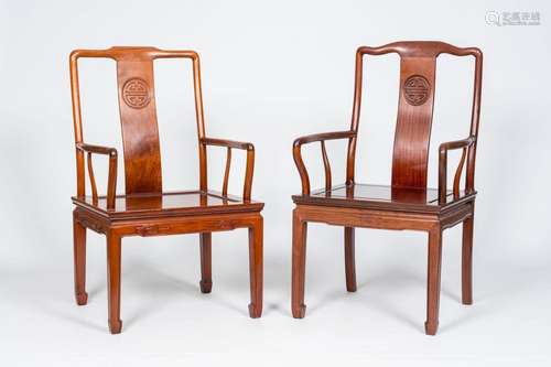 Two Chinese hardwood 'Shou' armchairs, 20th C.<br />
H 96,4 ...