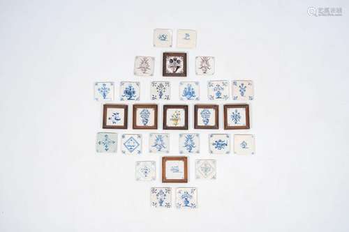 27 blue and white and manganese Dutch Delft tiles with flora...