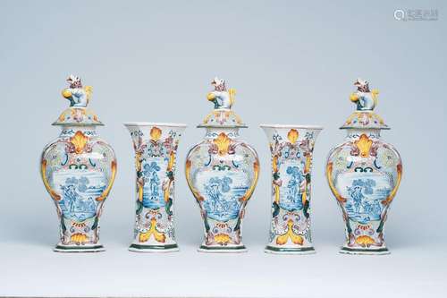 A Dutch Delft polychrome five-piece vase garniture with anim...