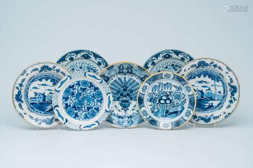 Seven various Dutch Delft blue and white chargers with lands...