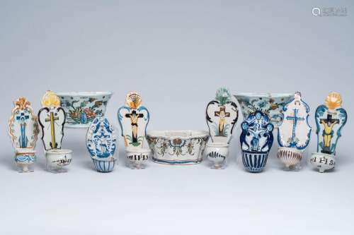 Eight blue and white and polychrome pottery holy water fonts...