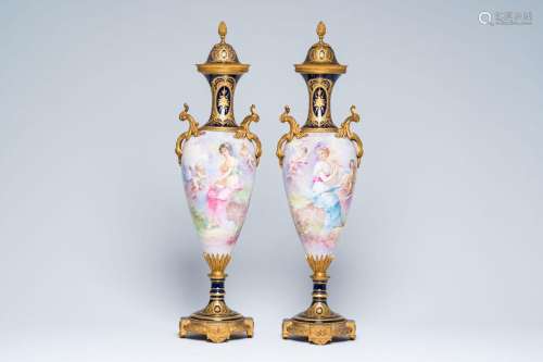 A pair of French gold layered blue ground gilt mounted vases...
