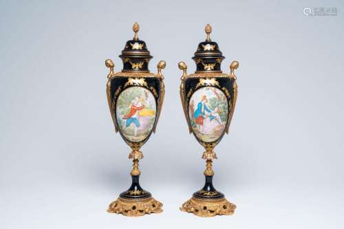 A pair of French Limoges gilt mounted blue ground vases and ...