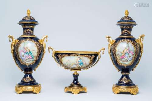 A French gilt mounted blue ground gold layered three-piece g...