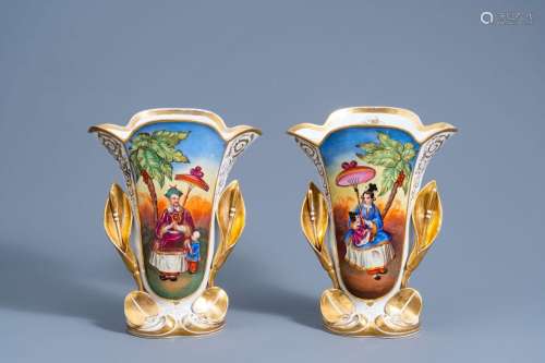 A pair of gilt and polychrome old Paris porcelain vases with...