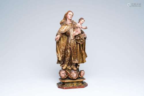 A Flemish polychromed wood sculpture of the Madonna with Chi...