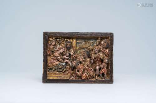 A Spanish carved, polychrome painted and gilt walnut relief ...