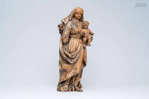 A carved wood Madonna and Child with traces of polychromy, 1...
