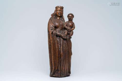 A carved wood Madonna and Child, 17th C.<br />
H 71,9 cm<br ...