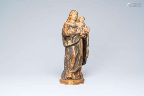 A German carved, polychrome painted and gilt wood Madonna an...