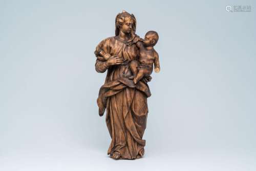 A carved wood Madonna and Child, 18th C.<br />
H 70 cm<br />...