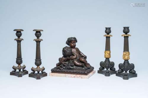 Two pairs of French gilt and patinated bronze candlesticks a...