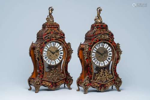 A pair of German Boulle style cartel clocks with faux tortoi...