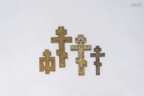 Four orthodox patinated, gilt and partly enamelled bronze ic...