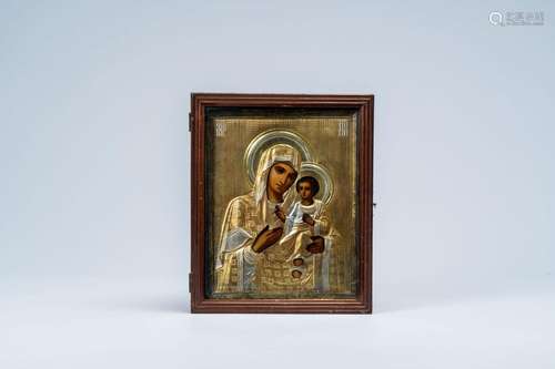 An orthodox 'Mother of God' icon with partly gilt silver okl...