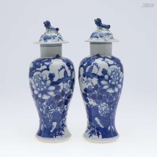 PAIR OF CHINESE BLUE & WHITE VASES & COVERS.