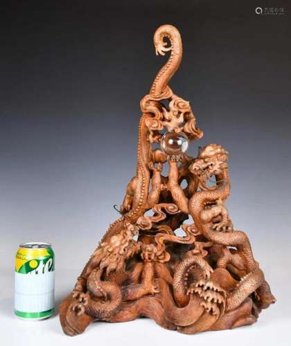 A Carved Hardwood Chasing Dragons Ornament 20thC
