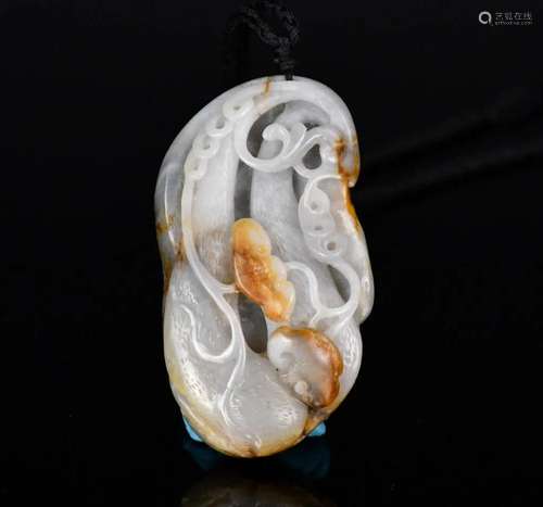 A Carved Grey & Russet Jade Melon Pendant