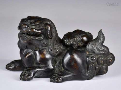 A Bronze Buddhist Lion Qing