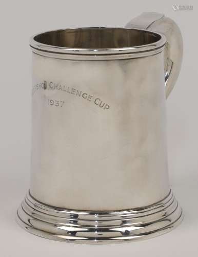 A silver mug, London, 1936, H Phillips, with scroll handle a...