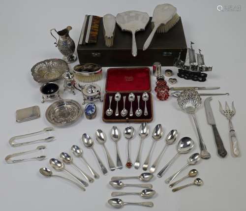 A group of mixed silver, to include: a four piece silver mou...