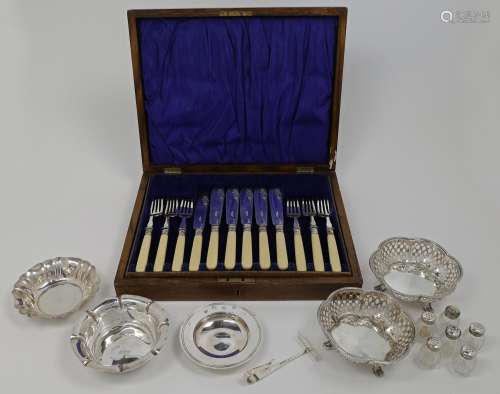 A group of silver, comprising: a near pair of pierced dishes...