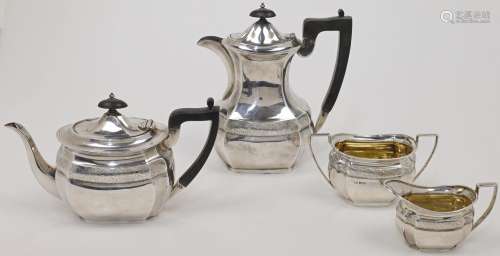 A silver matched tea and coffee service, with chased foliate...