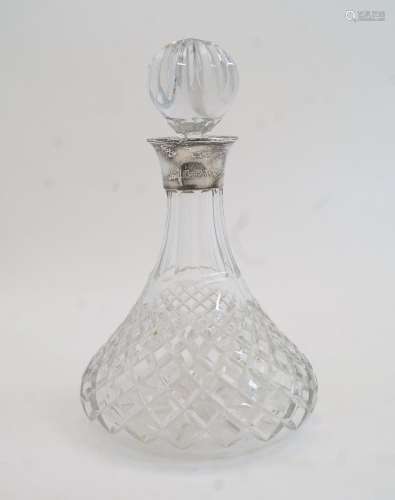 A silver mounted cut glass ships decanter and stopper, Birmi...