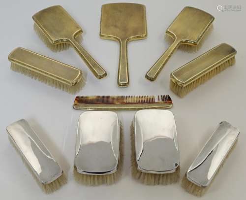 A silver-gilt dressing table set, by Mappin & Webb, Lond...