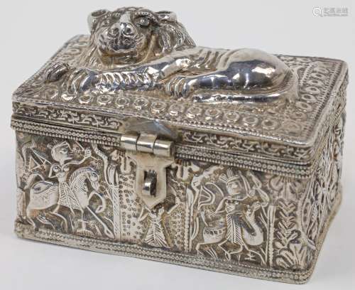 A white metal box, repousse decorated with recumbent lion to...