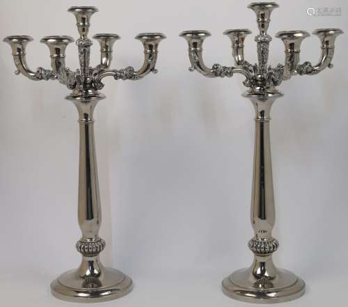 A pair of plated five light candelabra, each with foliate br...