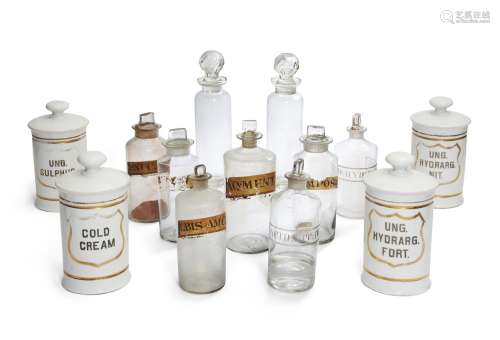 A group of ceramic and glass apothecary jars and bottles, 19...