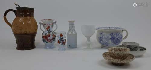 A mixed collection of ceramics and glass, to include an opaq...