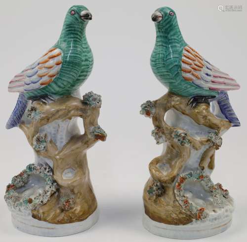 A pair of Victorian Staffordshire models of exotic birds, ea...