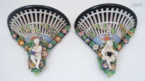 A pair of German porcelain wall brackets, 19th century, of p...