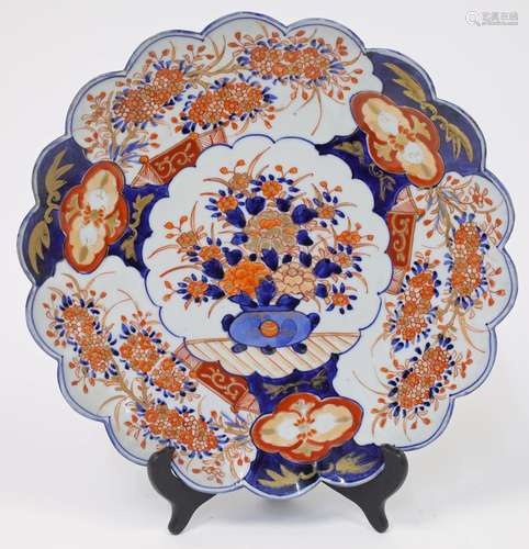 A Japanese porcelain Imari palette scalloped rim circular di...