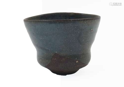 A Japanese shaped blue-green mottle glazed earthenware cup, ...