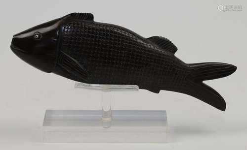 A Chinese carved hardwood model of a fish, 20th century, wit...