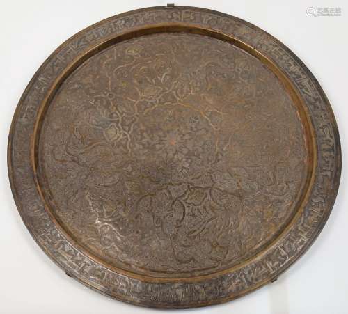 A large Islamic bronze dish, 20th century, decorated with el...